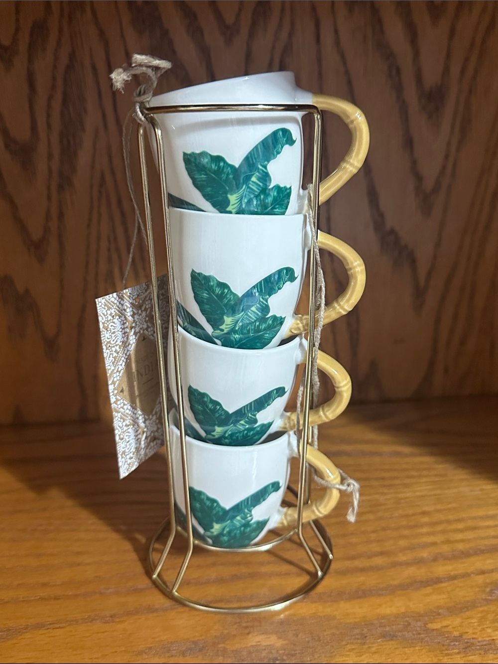 Made in India set of 4 palm leaf espresso mugs with a gold metal stand